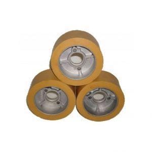 Three spare rubber wheels for a power feed unit