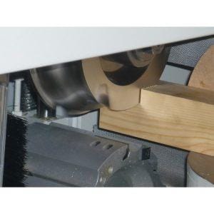 Wooden plank being processed in the Pentho Compact 4 Tenoner